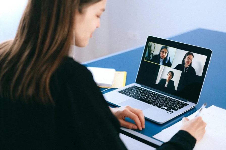 a woman in a virtual conference meeting